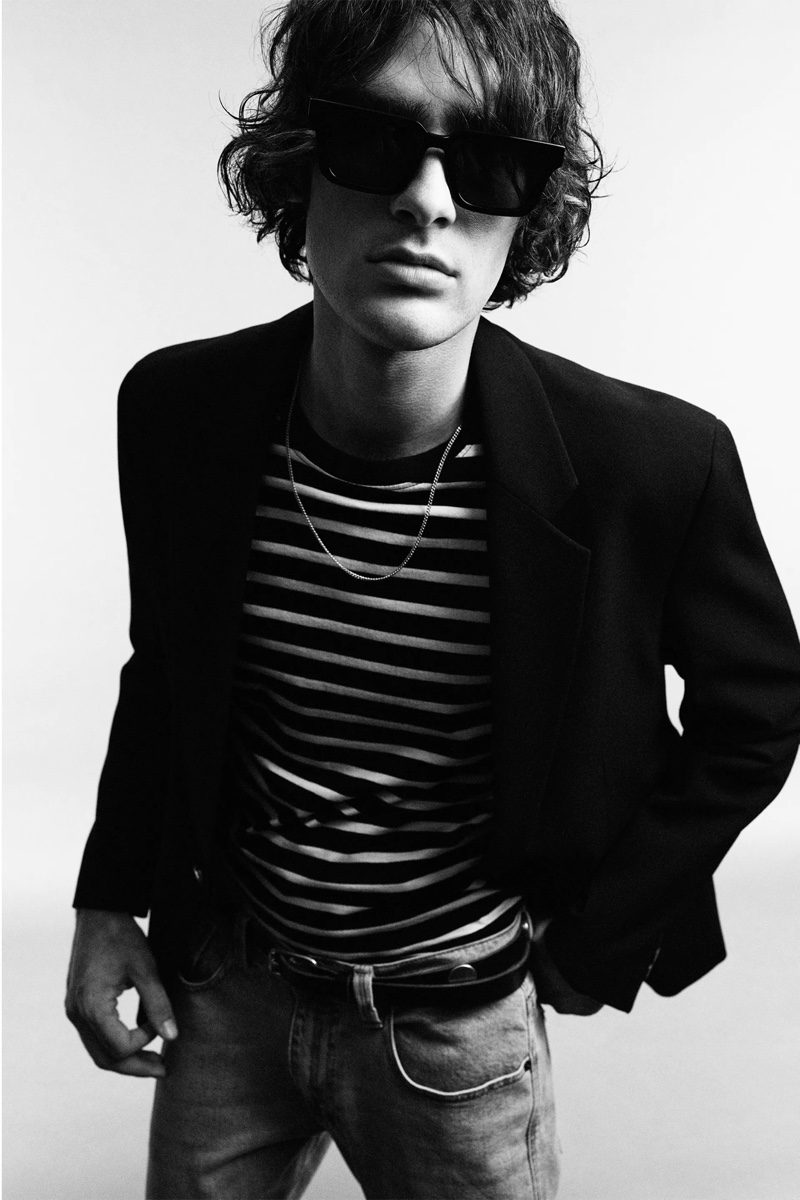 Marijn Aper models a double-breasted cotton blazer with a striped t-shirt and denim jeans from Zara Man's Rock collection.