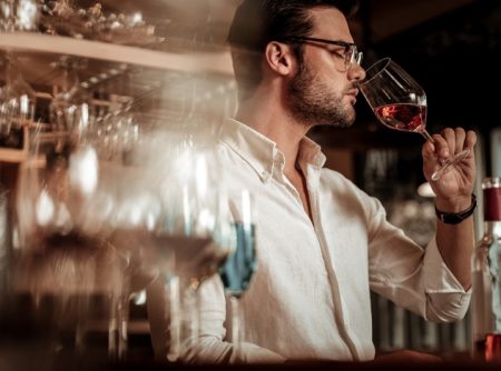 Attractive Man Smelling Wine