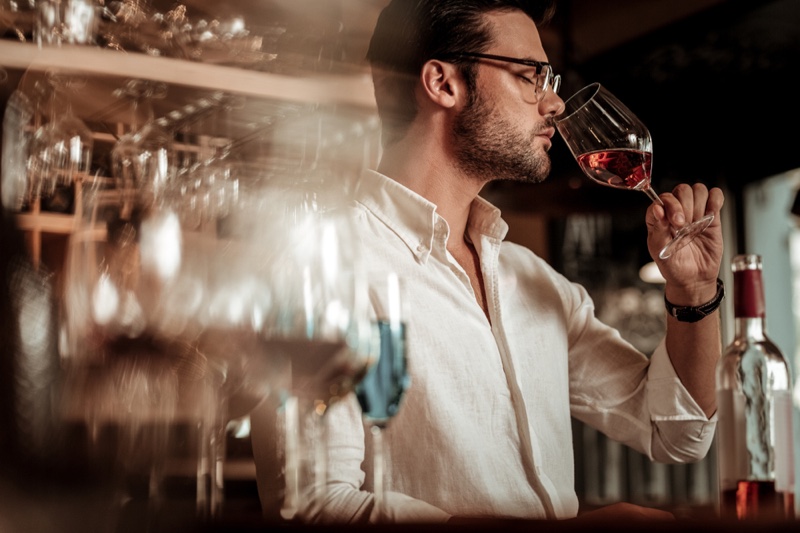 Attractive Man Smelling Wine