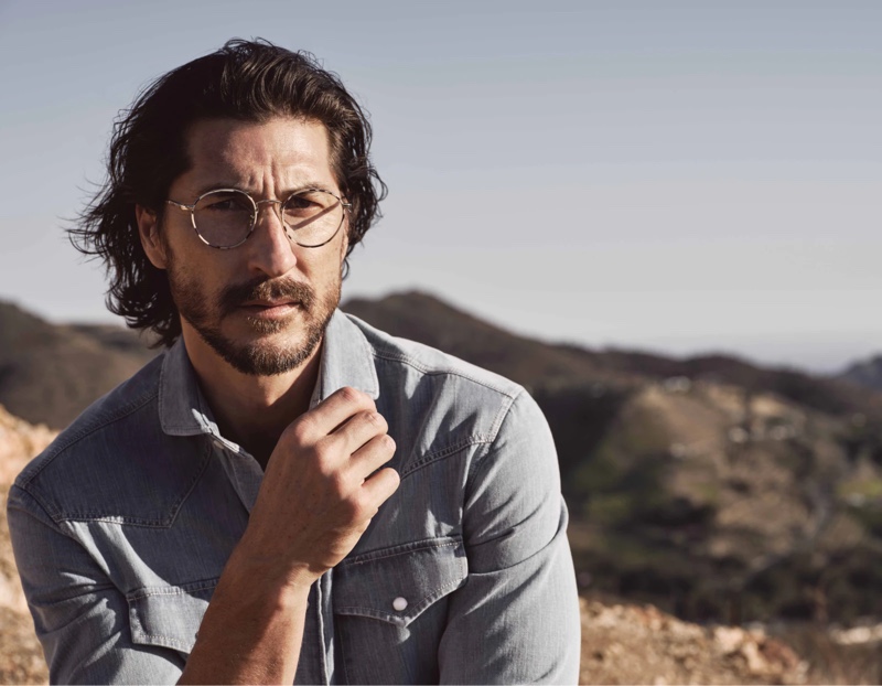 Ryan Porter dons glasses for the fall-winter 2021 Brunello Cucinelli x Oliver Peoples eyewear campaign.