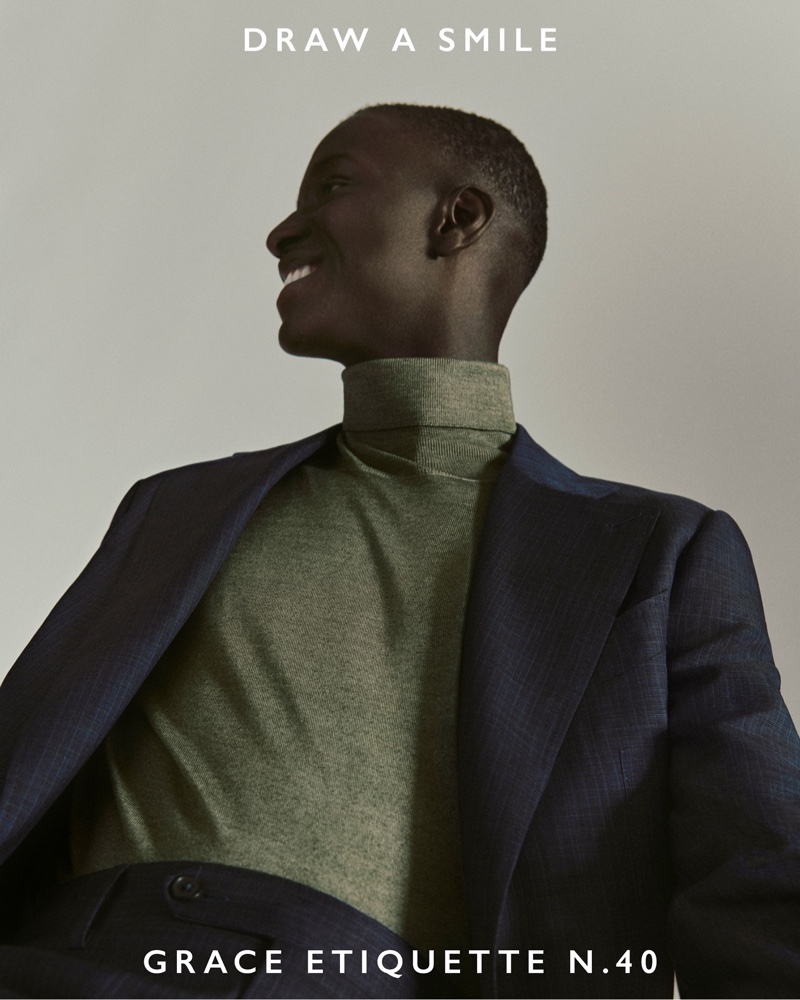 All smiles, Lamine Faty appears in Canali's fall-winter 2021 campaign.