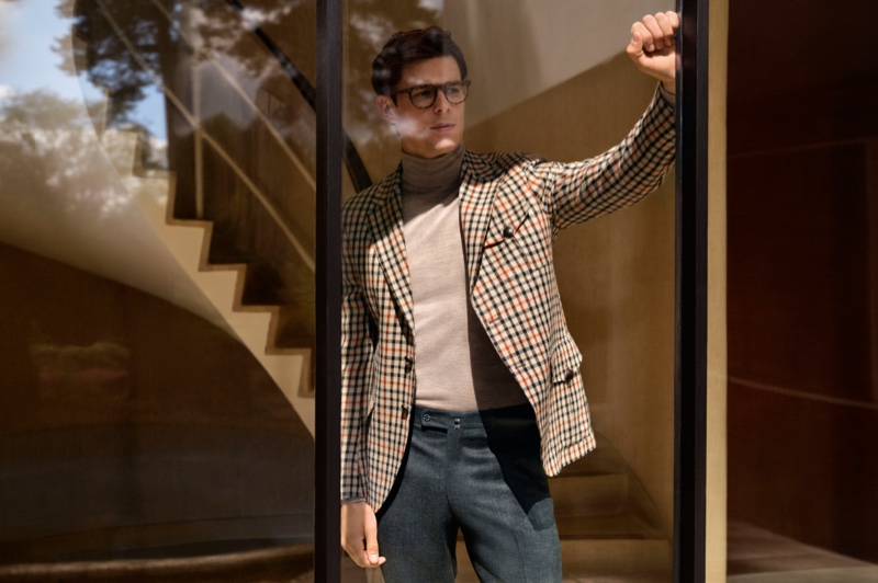 Donning a turtleneck and check jacket, Lewis Jamison fronts Daks' fall-winter 2021 campaign.