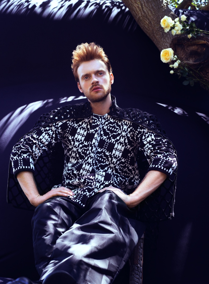 Embracing a graphic black and white look, Finneas wears Comme des Garçons with a Valentino cape for VMAN.