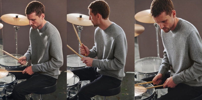 Going casual in a crewneck sweater, George Barnett plays the drums for Massimo Dutti.