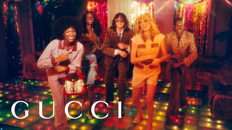 Grace Epolo, Lamich Kirabo, Branko Roegiest, Claire DeLozier, and Don Nahumuremy channel seventies style with a disco-themed image from the Gucci 100 campaign.