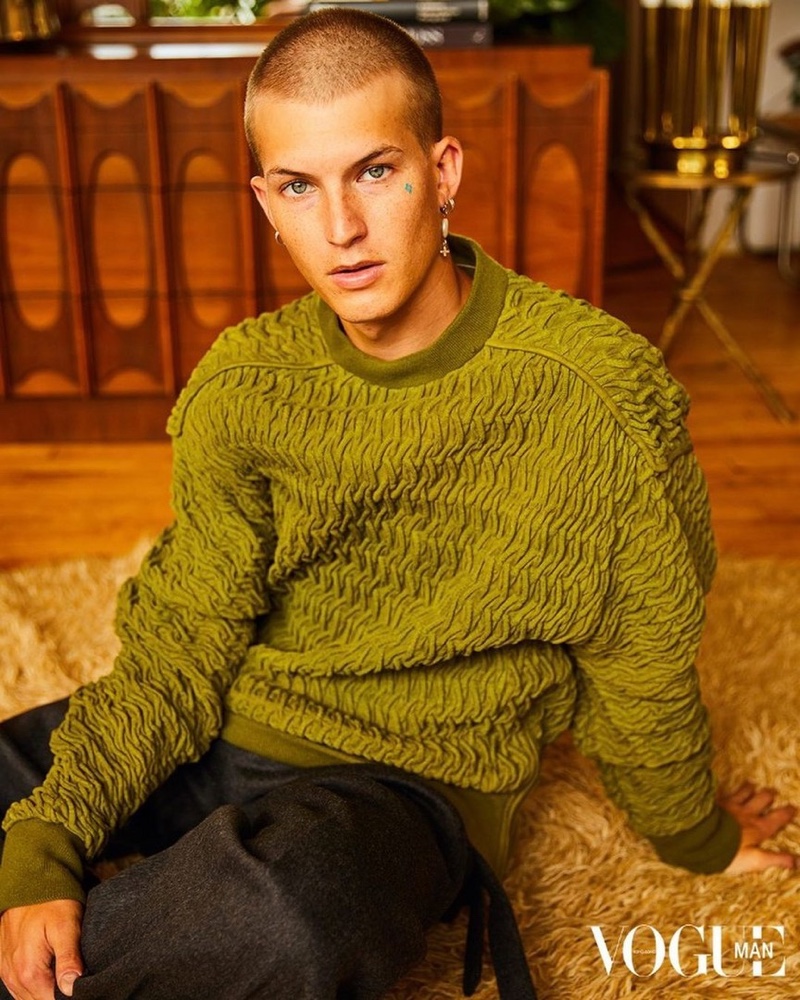 In front and center, Gus Dapperton sports a sweater and pants from Ermenegildo Zegna for Vogue Man Hong Kong.