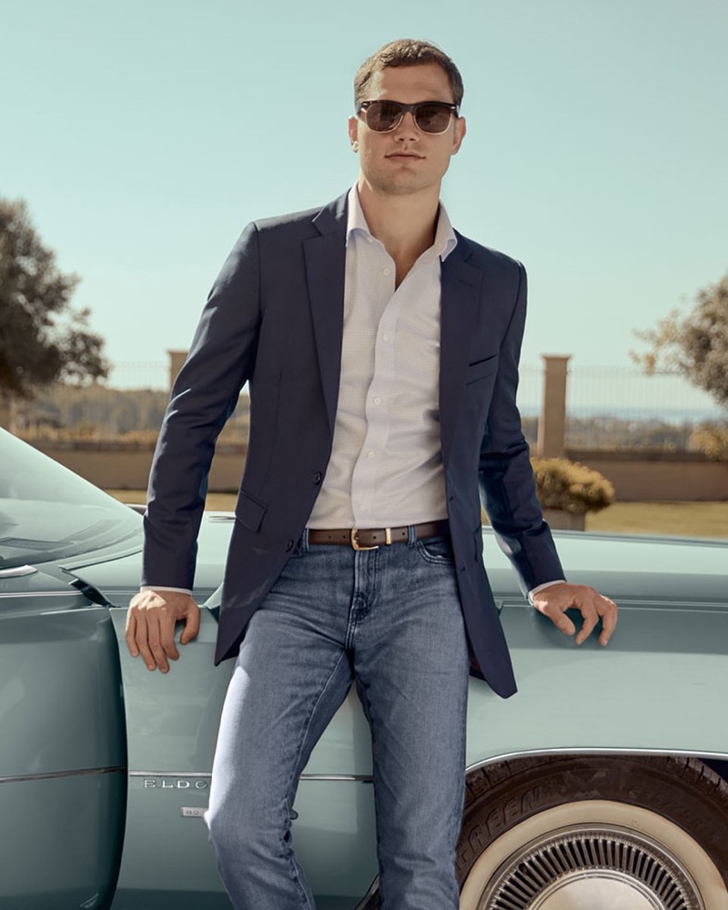 In front and center, Stefan Pollmann models a shirt with a suit jacket and denim jeans from Hockerty.