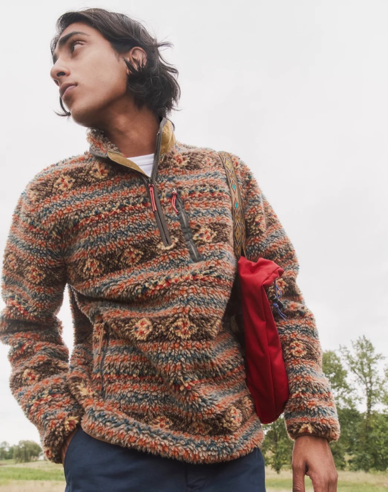 Making a cozy statement, Adarsh Jaikarran sports a J.Crew Nordic fair isle sherpa fleece pullover.