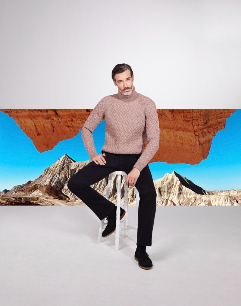 Sitting for a photo, Richard Biedul wears a cable-knit turtleneck from John Smedley.