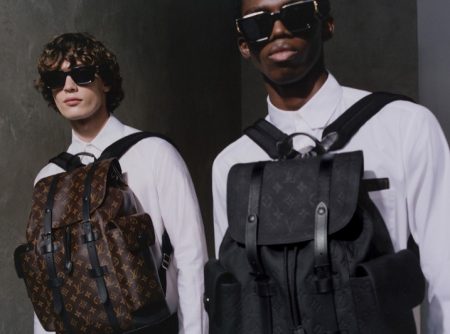 Models Freek Iven and Ottawa Kwami wear Louis Vuitton's Christopher PM backpacks.