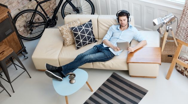 Securing & Transforming Your First Bachelor Pad Man Relaxing at Home