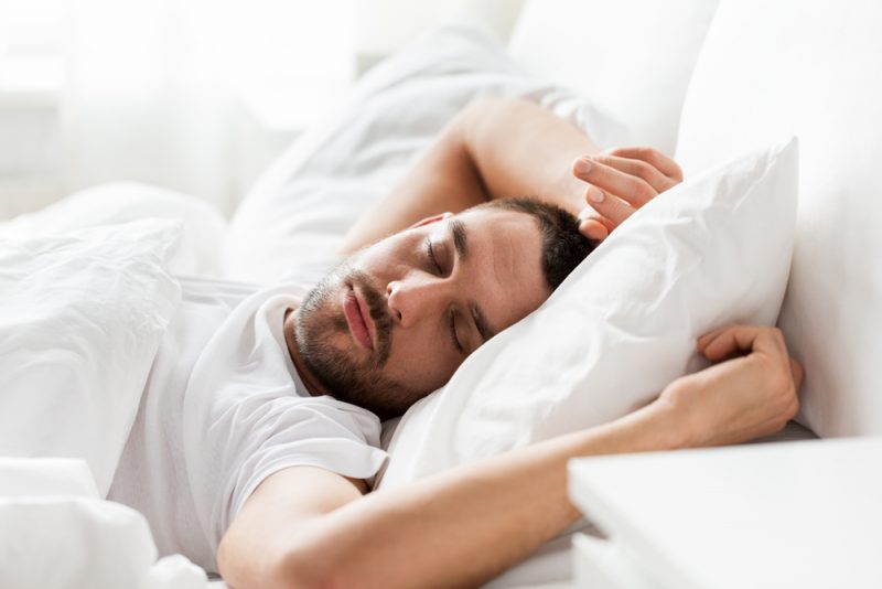 Man Sleeping in Bed