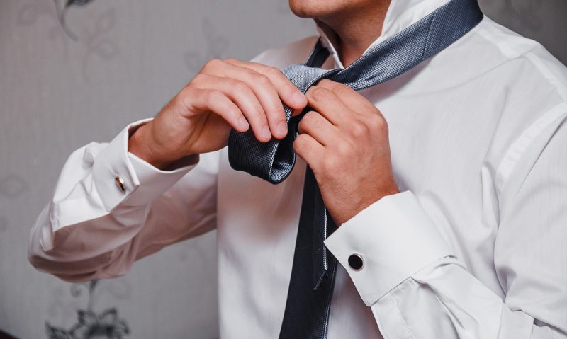 Man Tying Tie