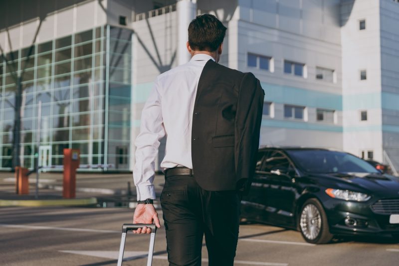 Man Wearing Suit GOing to Airport