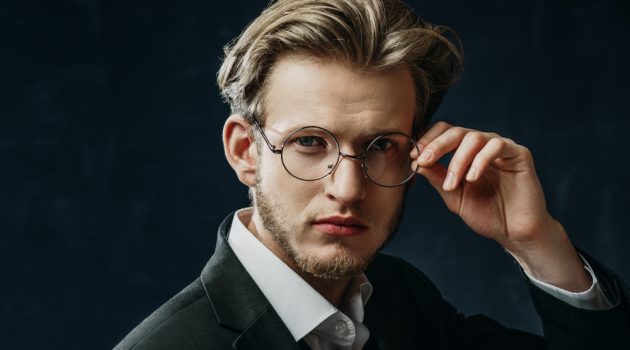 Eyewear Trends That Set the Mark for 2021 Man Wearing Thin Rim Glasses