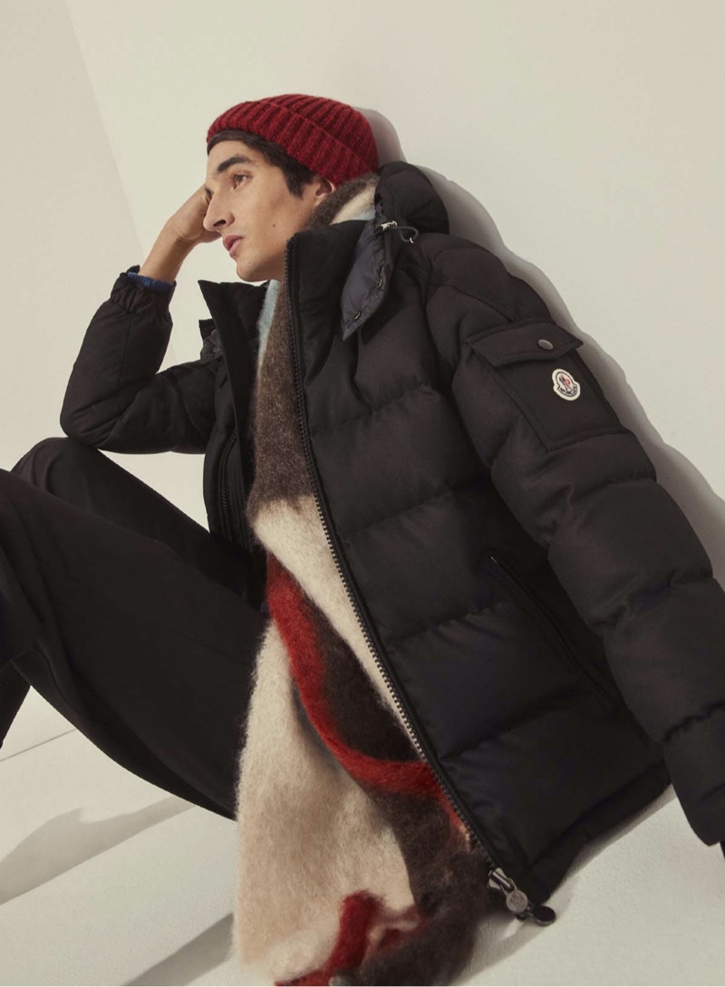 Pablo Fernandez wears a Moncler Montgenevre down-filled jacket with Marni wool tailored pants, a Gabriela Hearst Lutz cashmere beanie and a Jil Sander intarsia knitted mohair and wool scarf.