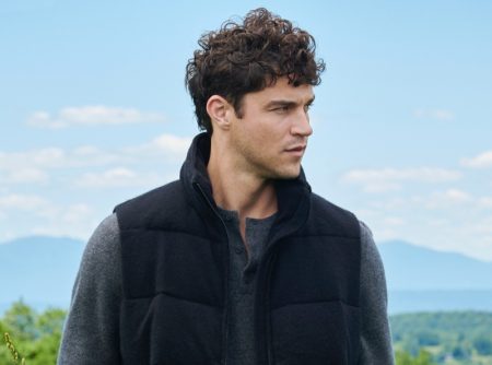 Miles McMillan stays warm in a puffer vest and henley for NAKEDCASHMERE's fall 2021 campaign.