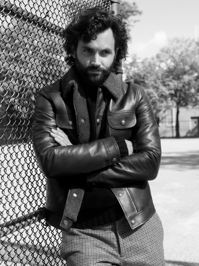 Donning a Tom Ford leather down jacket, Penn Badgley also sports a Studio Nicholson mock-neck sweater, and Tod's houndstooth trousers for Mr Porter.