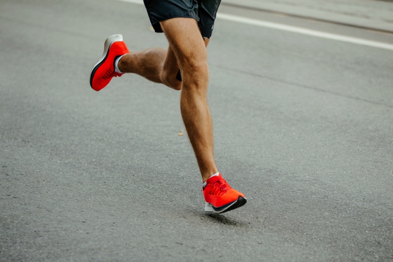 Red Sneakers Running Asphalt