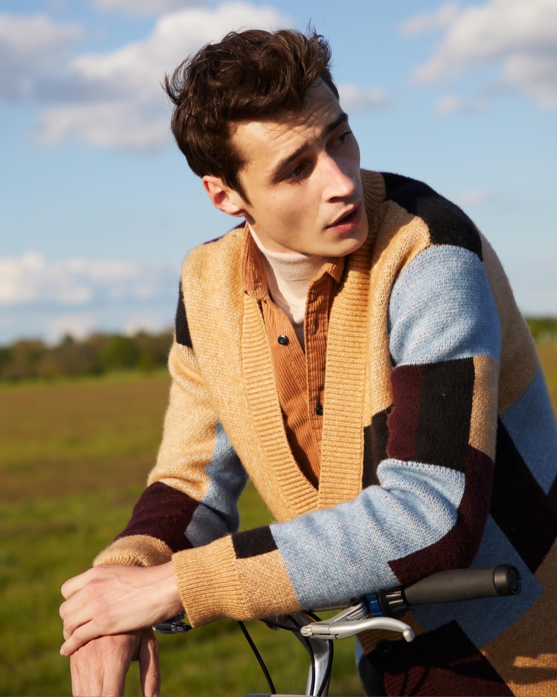 Making a graphic style statement, Adrien Sahores rocks a Scotch & Soda relaxed jacquard cardigan.