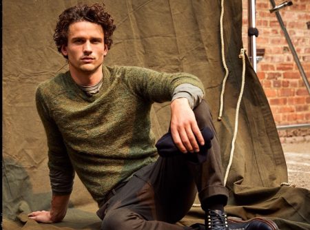 Taking a seat, Simon Nessman dons Todd Snyder's brushed Italian mohair sweater with Italian moleskin carpenter pants.