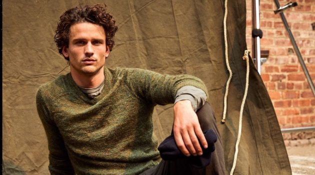 Taking a seat, Simon Nessman dons Todd Snyder's brushed Italian mohair sweater with Italian moleskin carpenter pants.