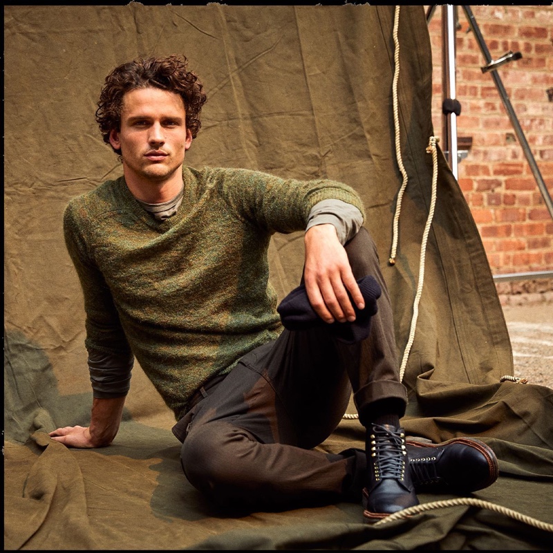 Taking a seat, Simon Nessman dons Todd Snyder's brushed Italian mohair sweater with Italian moleskin carpenter pants.