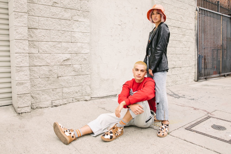 Cameron Porras and Shanley McIntee wear UGG's Neumel Cow Print and Classic Ultra Mini Cow Print for the brand's fall-winter 2021 "Feel You" campaign.