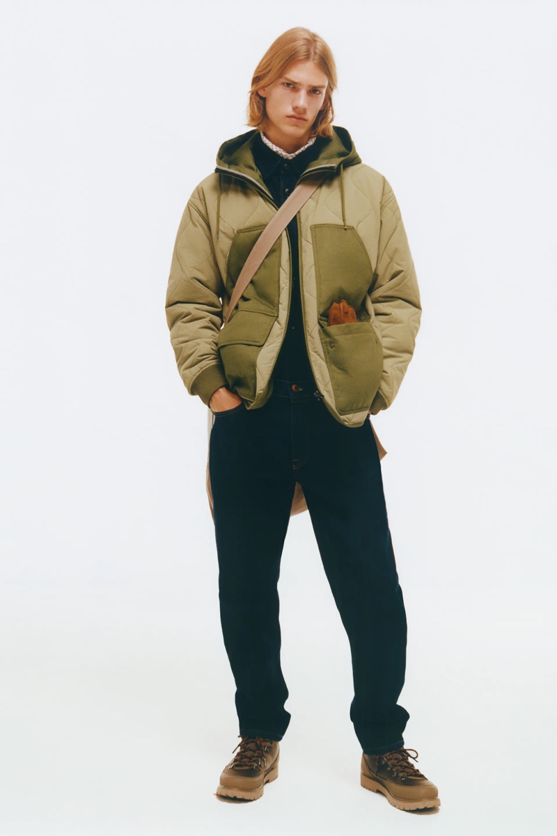 Model Martijn Faaij wears a combination puffer jacket with textured cotton pants by Zara.