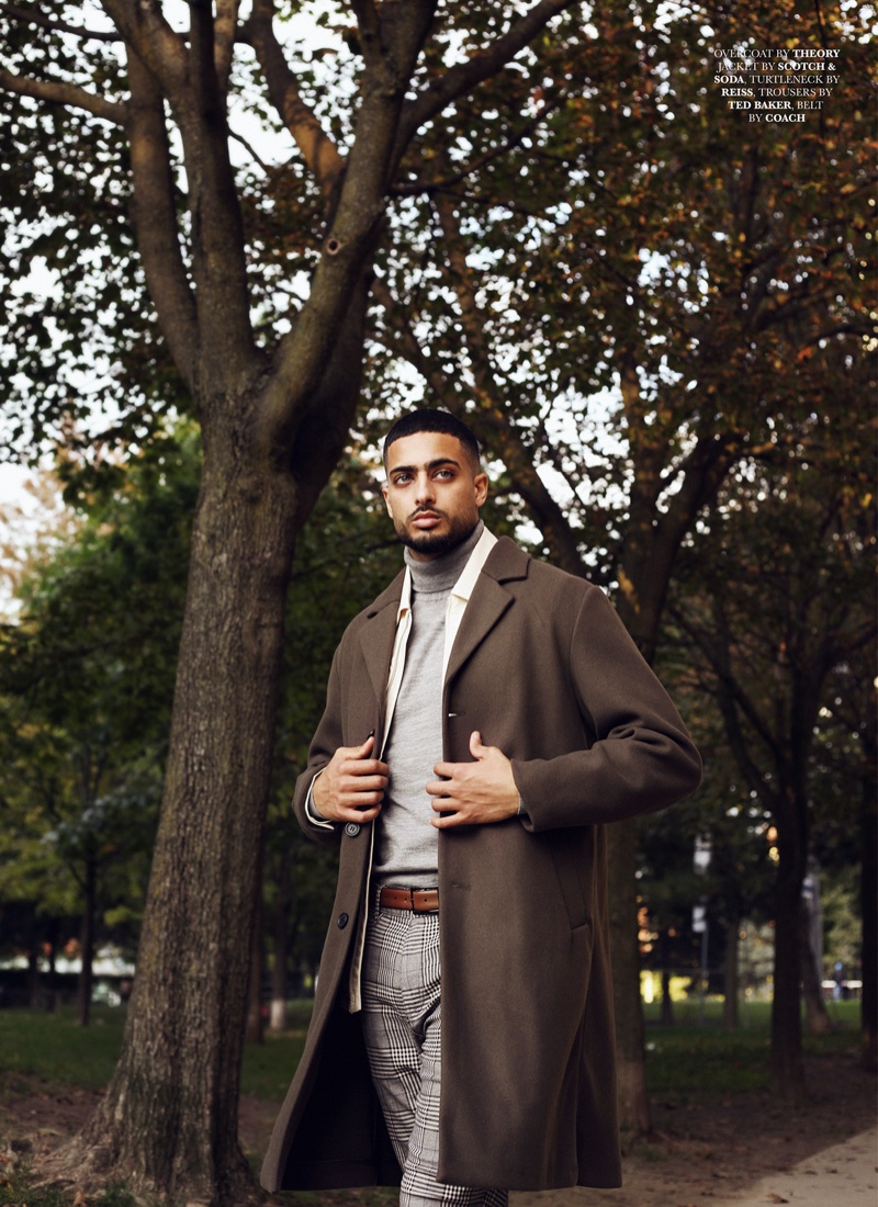 Ali wears coat Theory, jacket Scotch & Soda, turtleneck Reiss, trousers Ted Baker, and belt Coach.