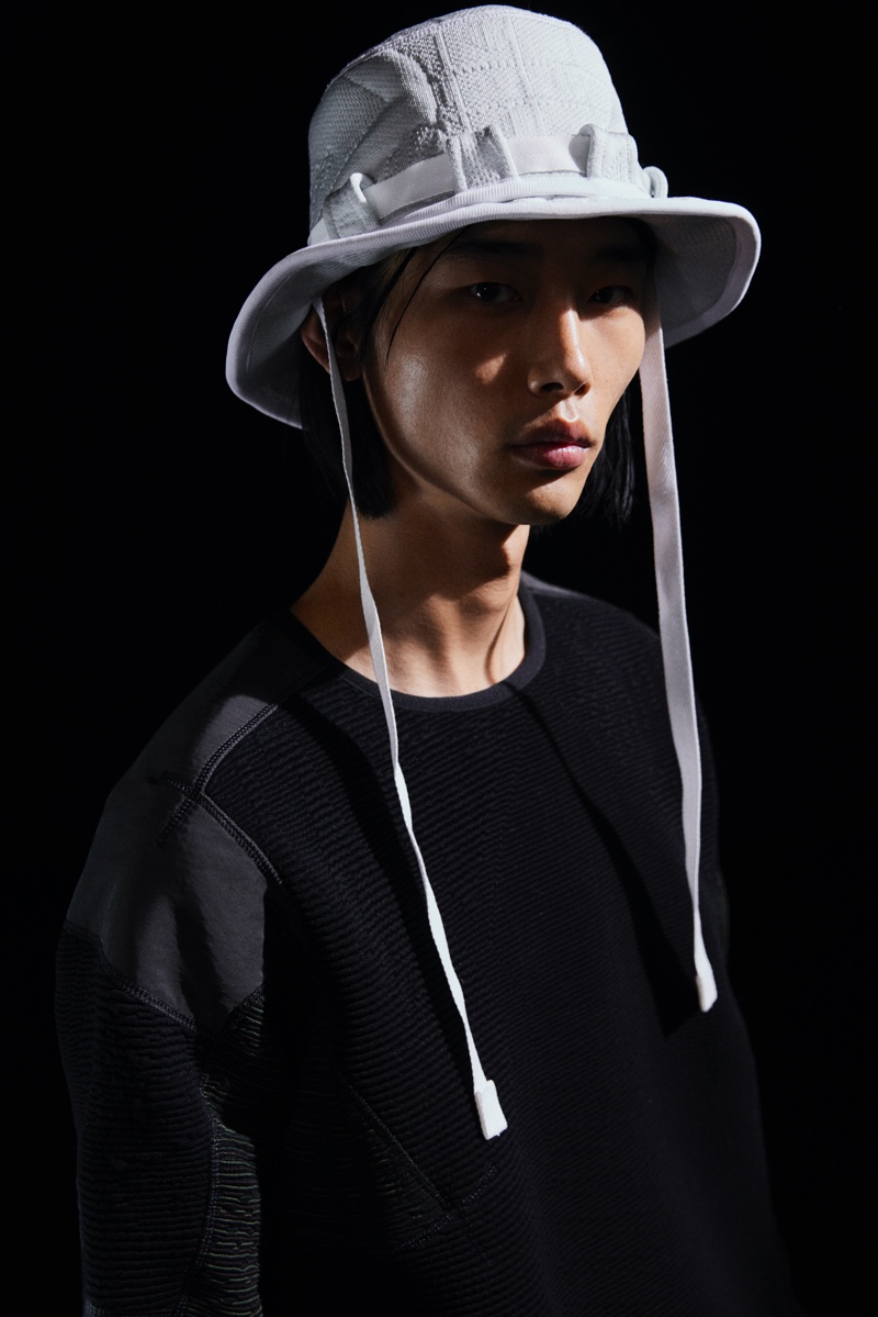 Sporting a bucket hat and sweater, Tae Min Park dons pieces from the Mytheresa x BYBORRE capsule collection.