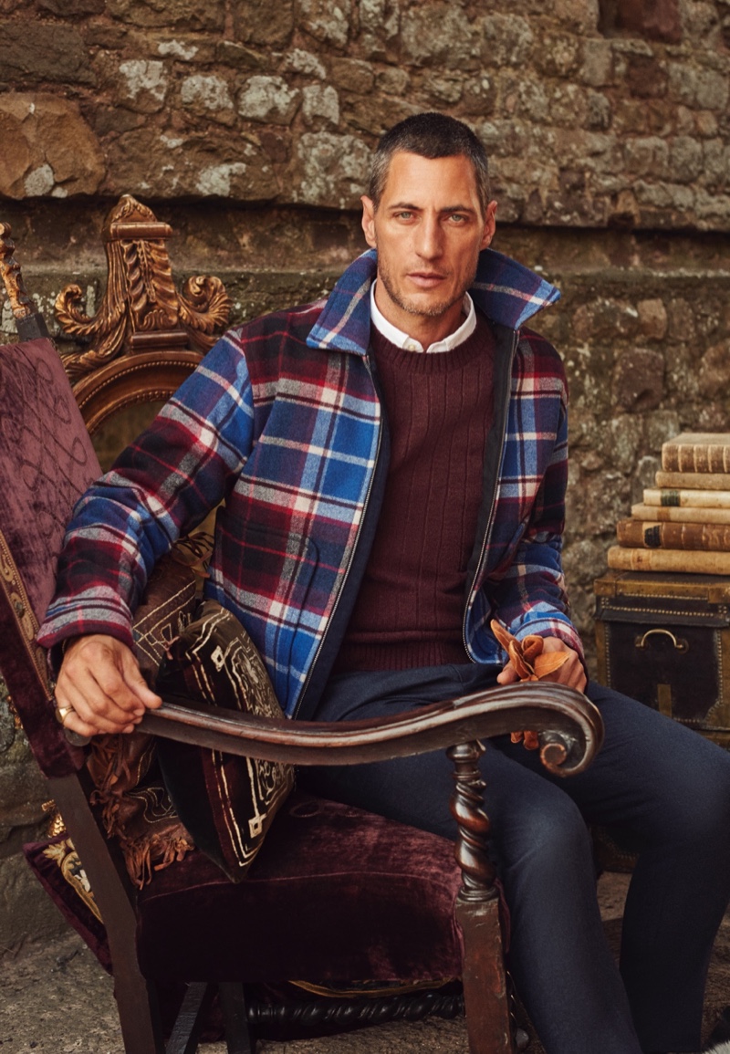 Standing out in a vibrant plaid jacket, Axel Hermann fronts Banana Republic's holiday 2021 campaign.