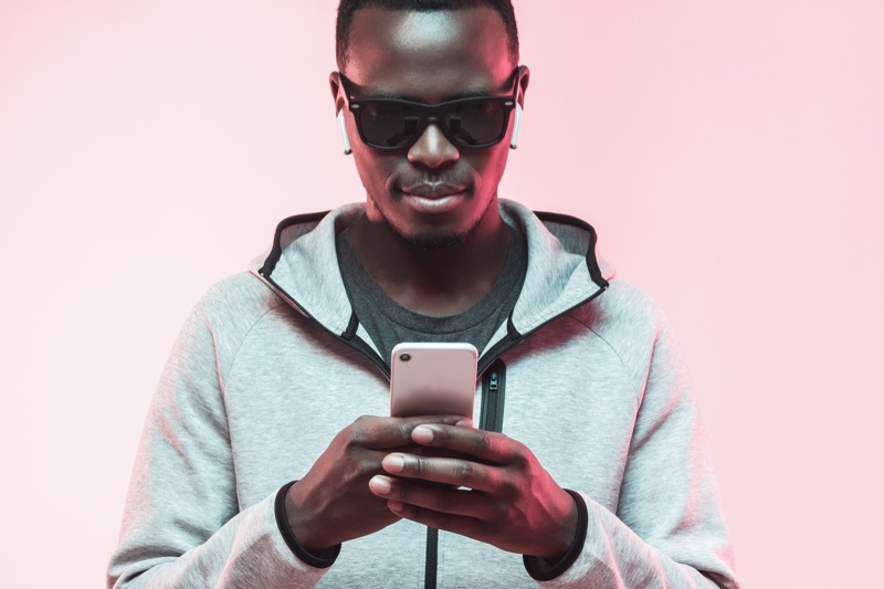 Black Man Using Phone Sunglasses Ear Pods