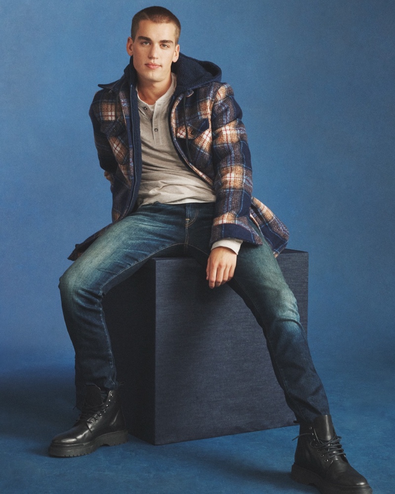 Showcasing casual style, Jake Hart wears a Buffalo David Bitton quilted shacket with jeans and leather boots.