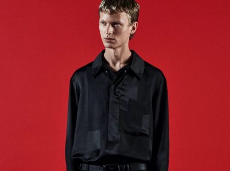 Donning black on black, Jonas Glöer fronts COS's holiday 2021 campaign.