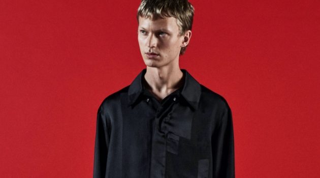 Donning black on black, Jonas Glöer fronts COS's holiday 2021 campaign.