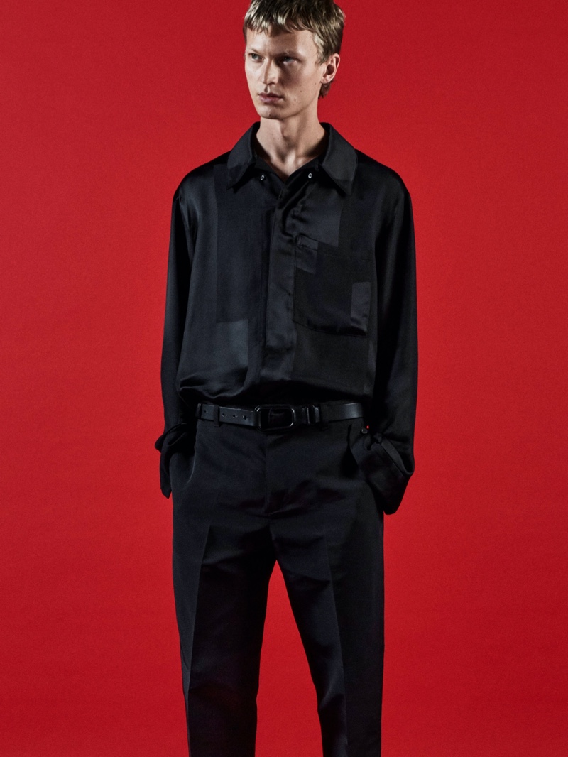 Donning black on black, Jonas Glöer fronts COS's holiday 2021 campaign.