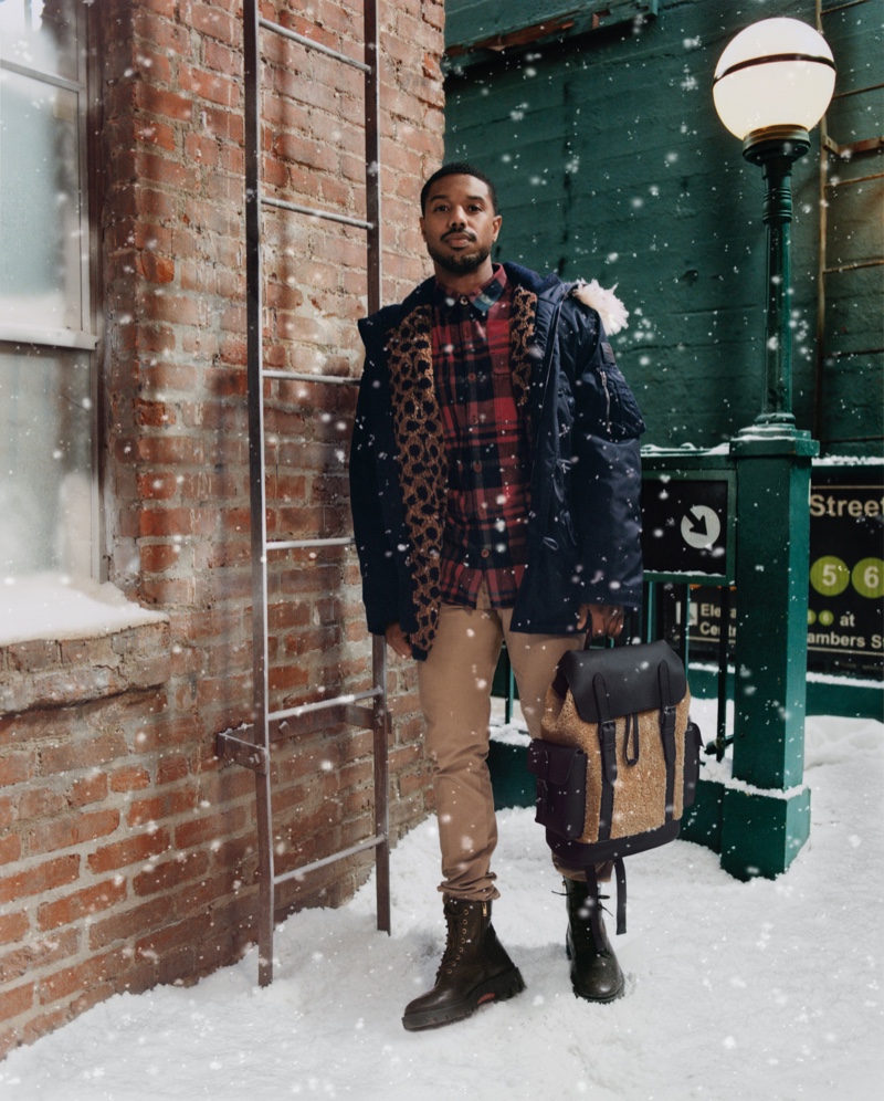 Sporting a parka, Michael B Jordan stars in Coach's new holiday 2021 campaign.
