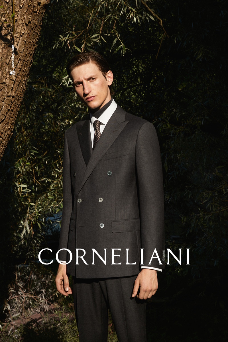 Theodor Pal dons an elegant double-breasted suit for Corneliani's fall-winter 2021 campaign.