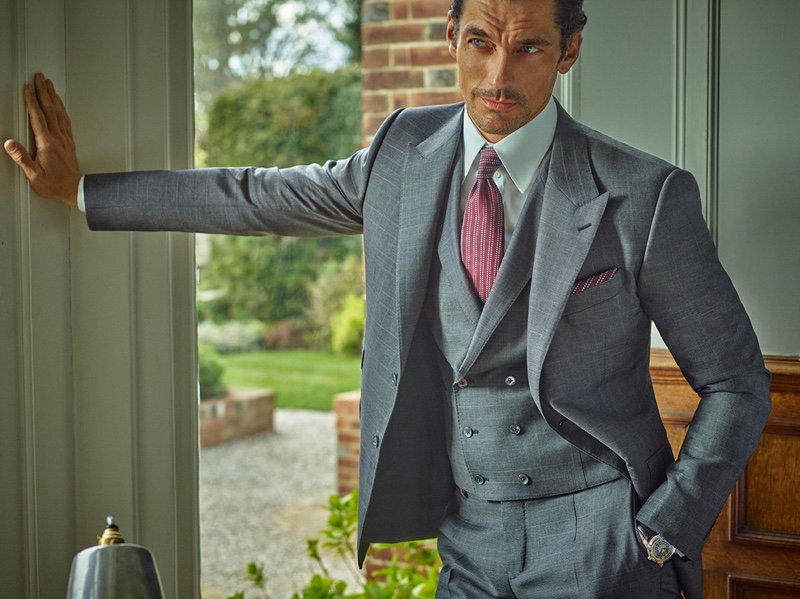 Wearing a three-piece suit in gray, David Gandy fronts Dolce & Gabbana's Made to Measure campaign.