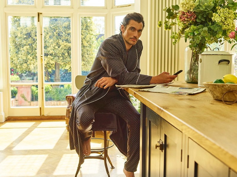 Proving that Dolce & Gabbana knows stylish leisure as well as it does suiting, David Gandy relaxes in a matching robe and pajama pants.