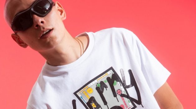 Evan Mock wears a cropped t-shirt from his Sorry in Advance x Giuseppe Zanotti collaboration.