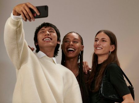 All smiles, Yuuki Tang, Ronja Berg, and Chai Maximus appear in HUGO's holiday 2021 campaign.