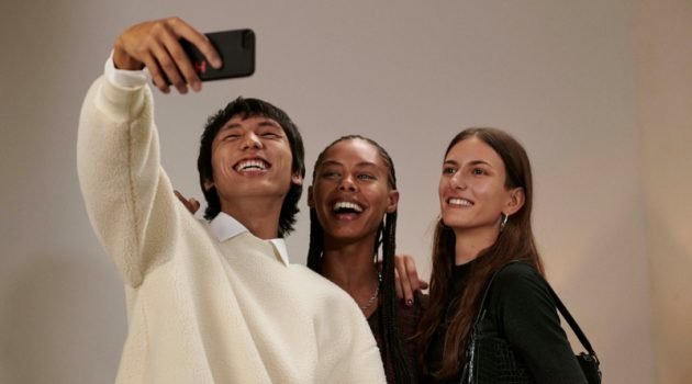 All smiles, Yuuki Tang, Ronja Berg, and Chai Maximus appear in HUGO's holiday 2021 campaign.