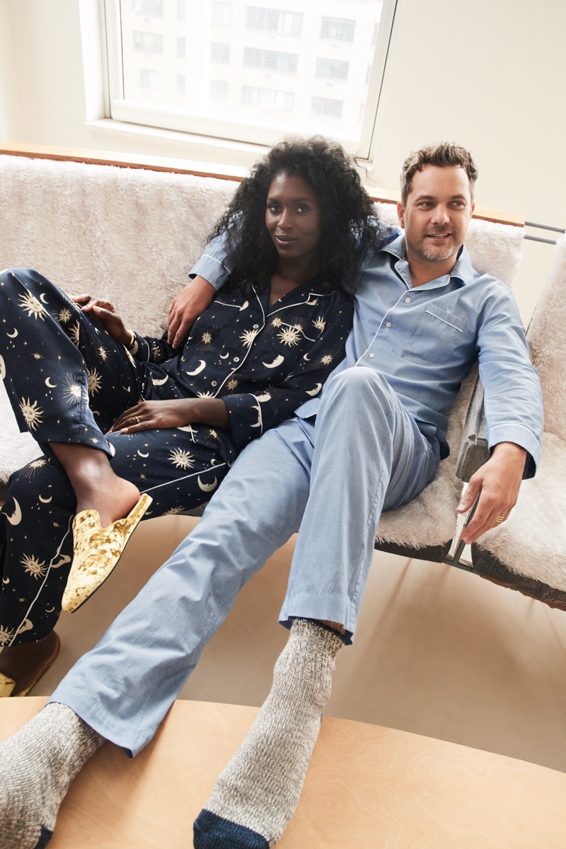 Getting cozy in J.Crew pajamas, real-life couple Jodie Turner-Smith and Joshua Jackson front the brand's holiday 2021 campaign.