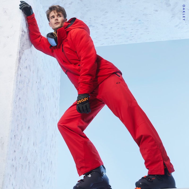 Model Lowell Tautchin strikes a pose in red Oakley for Holt Renfrew.