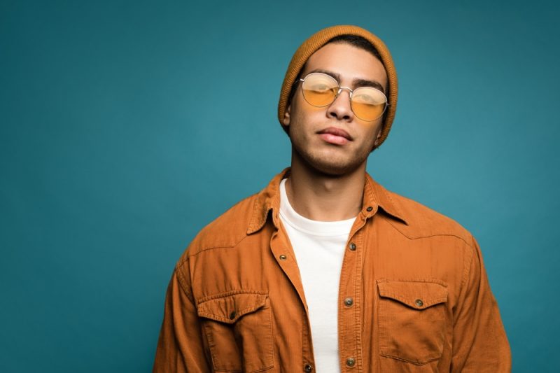 Man Wearing Orange Shirt Sunglasses Beanie