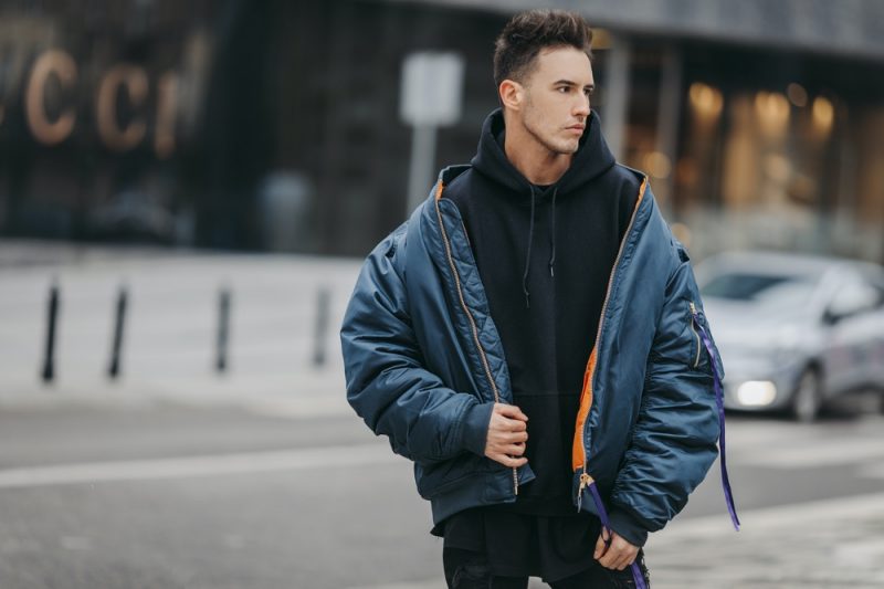 Man Wearing Oversized Bomber Jacket and Hoodie Man Wearing Oversized Bomber Jacket and Hoodie
