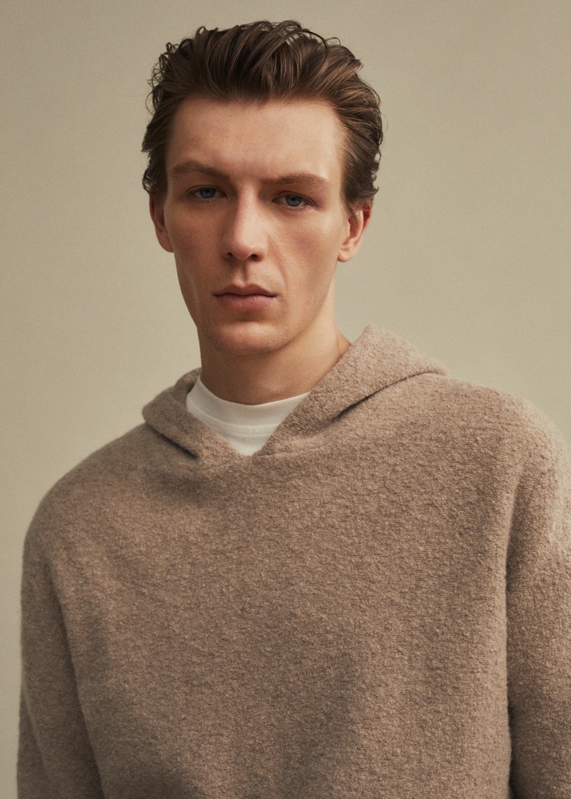 Model Finnlay Davis sports a Mango hoodie bouclé wool sweater.