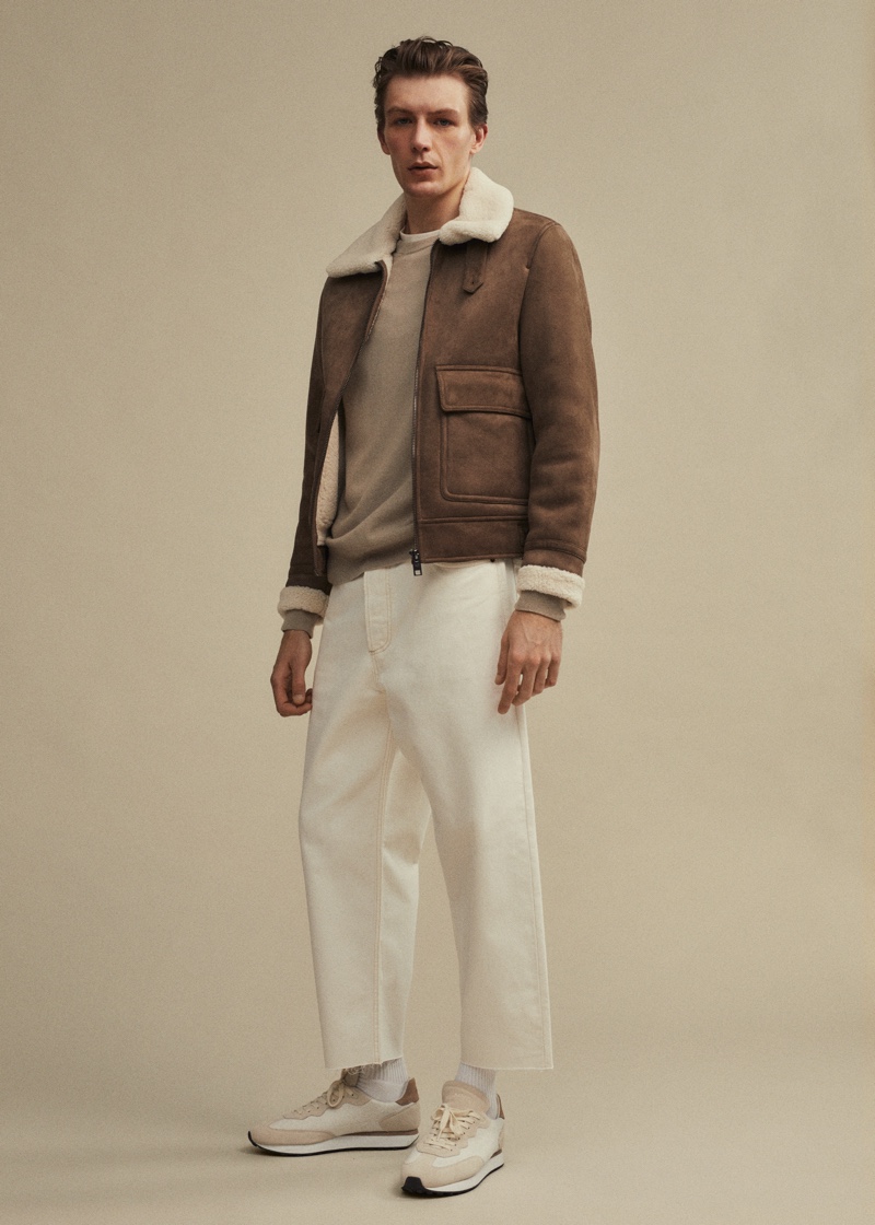 Finnlay Davis wears a shearling-lined aviator jacket with tapered loose cropped jeans by Mango.